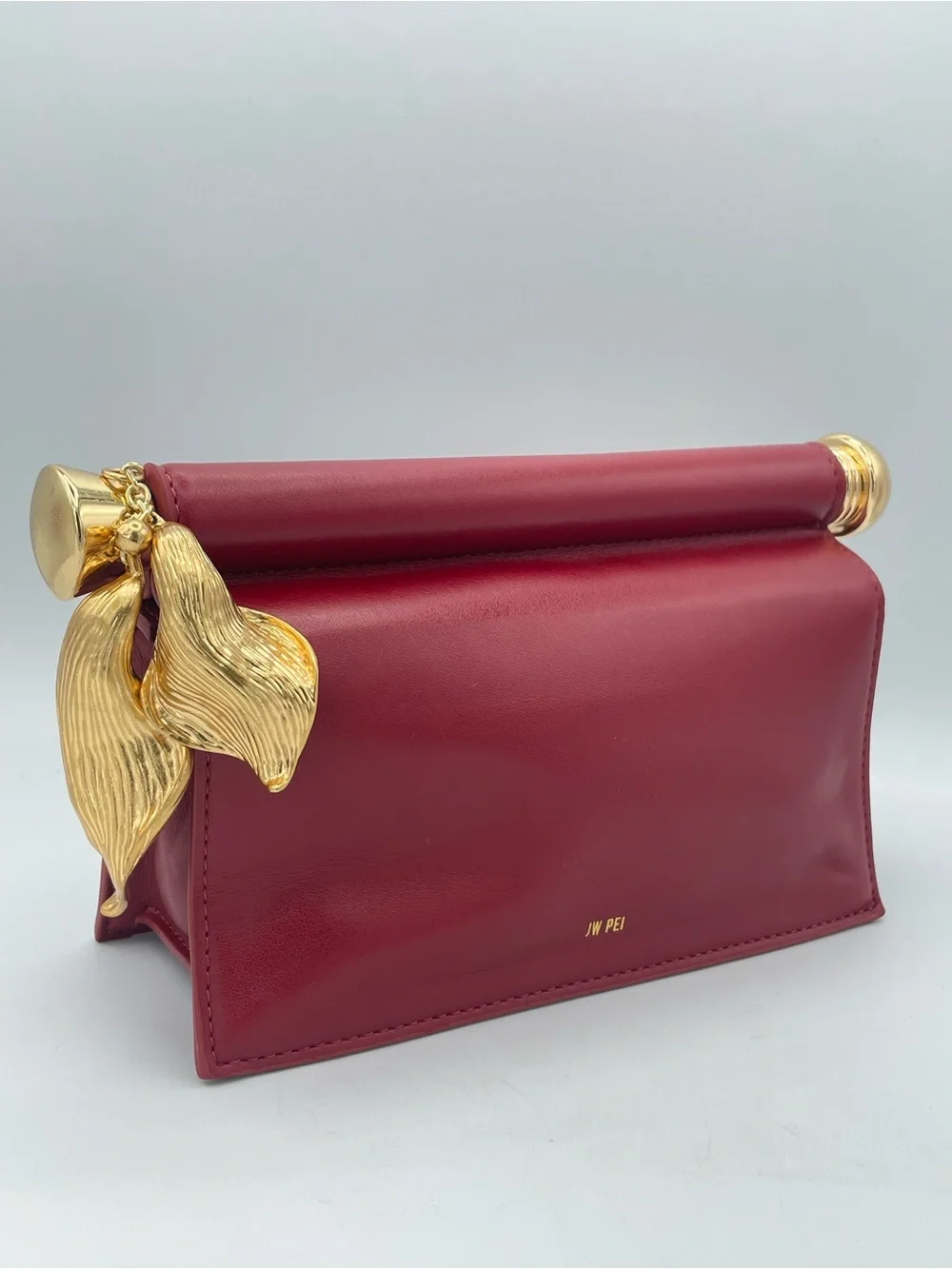 JW PEI Holly Clutch Claret Red Gold Floral Pendant Vegan Leather Bag